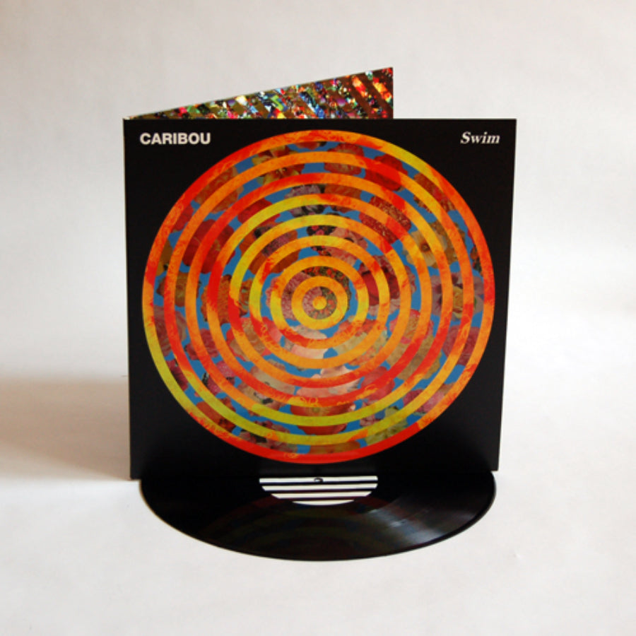 urlupload/https://www.mergerecords.com/stuff/contentmgr/files/0/d6d5104114604c05e56e16a14037bffb/image/348_caribou_swim_lp_500px.jpg
